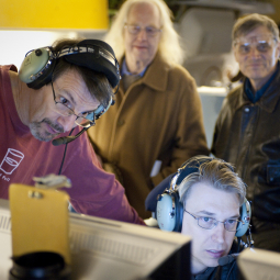 Jim De Buizer of USRA, at lower right, studies data with FORCAST's principal investigator Terry Herter, left, while astronomers Eric Becklin, SOFIA Scientific Advisor, and Mark Morris from UCLA, look on during preparations for the Stratospheric Observator