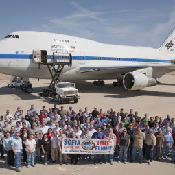 Members of SOFIA's staff gather to commemorate the 100th flight of the airborne observatory.